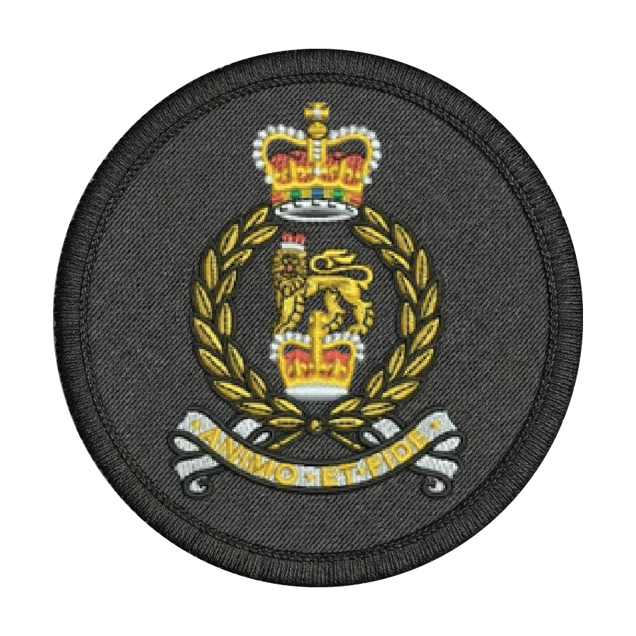 Circular military patch with a crown and laurel wreath design on a black background