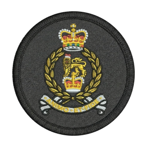 Circular military patch with a crown and laurel wreath design on a black background