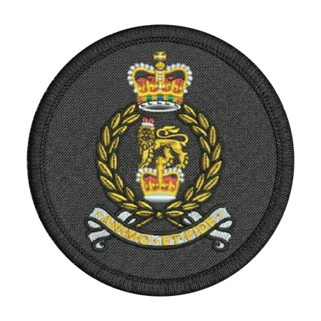 Circular military patch with a crown and laurel wreath design on a black background