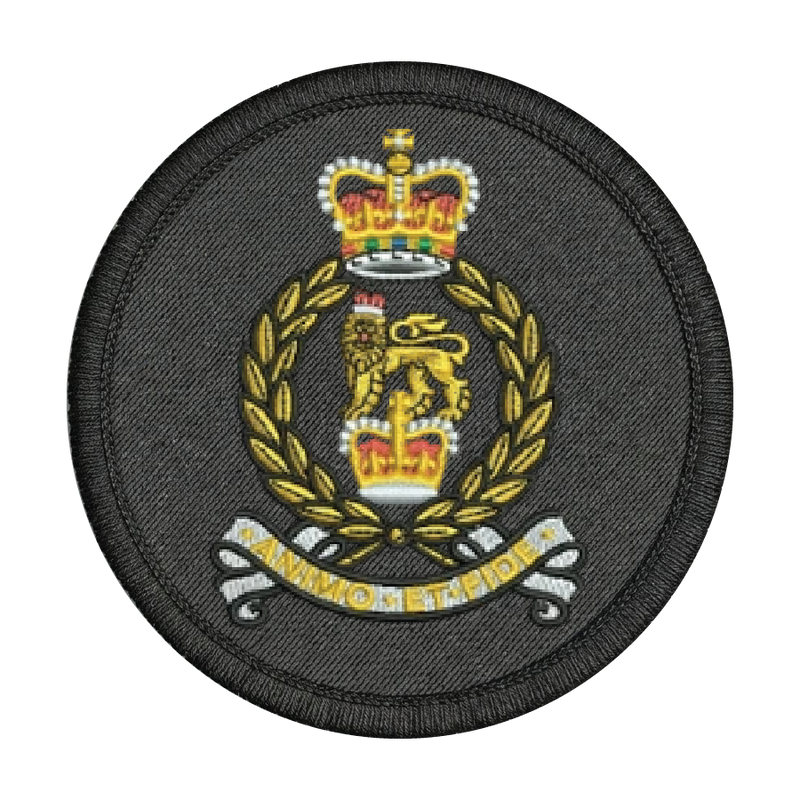 Circular military patch with a crown and laurel wreath design on a black background